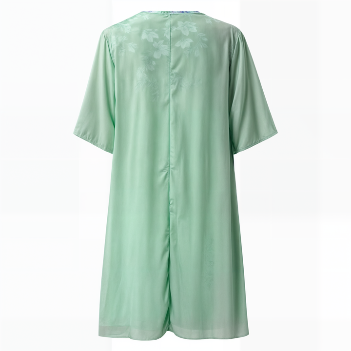 Knee-length woman dress with flower pressure and matc perhaps cardigan