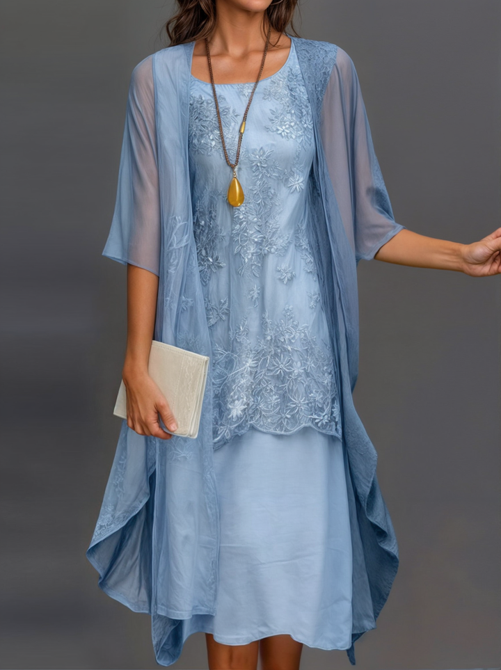 Knee-length woman dress with flower pressure and matc perhaps cardigan